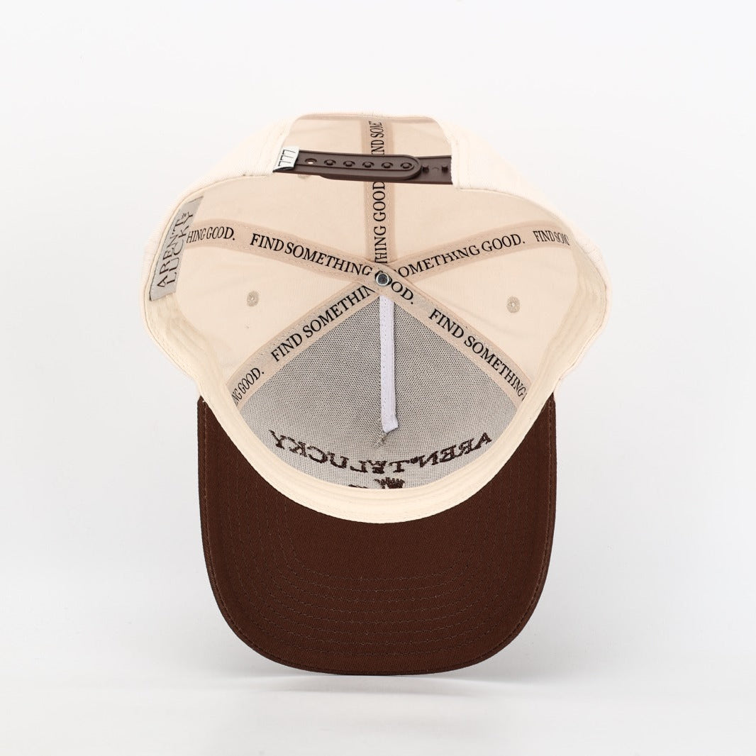 Beige and brown cap with 'Arent' Lucky 30a FL logo on a light gray background interior Find Something Good