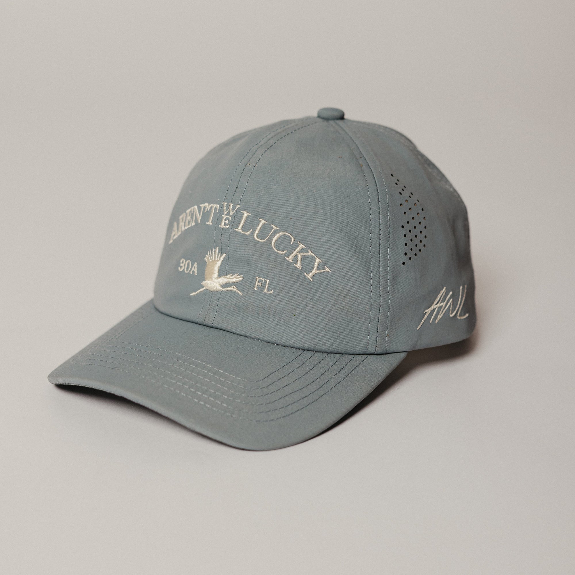 Gray cap with text and logo on a beige background